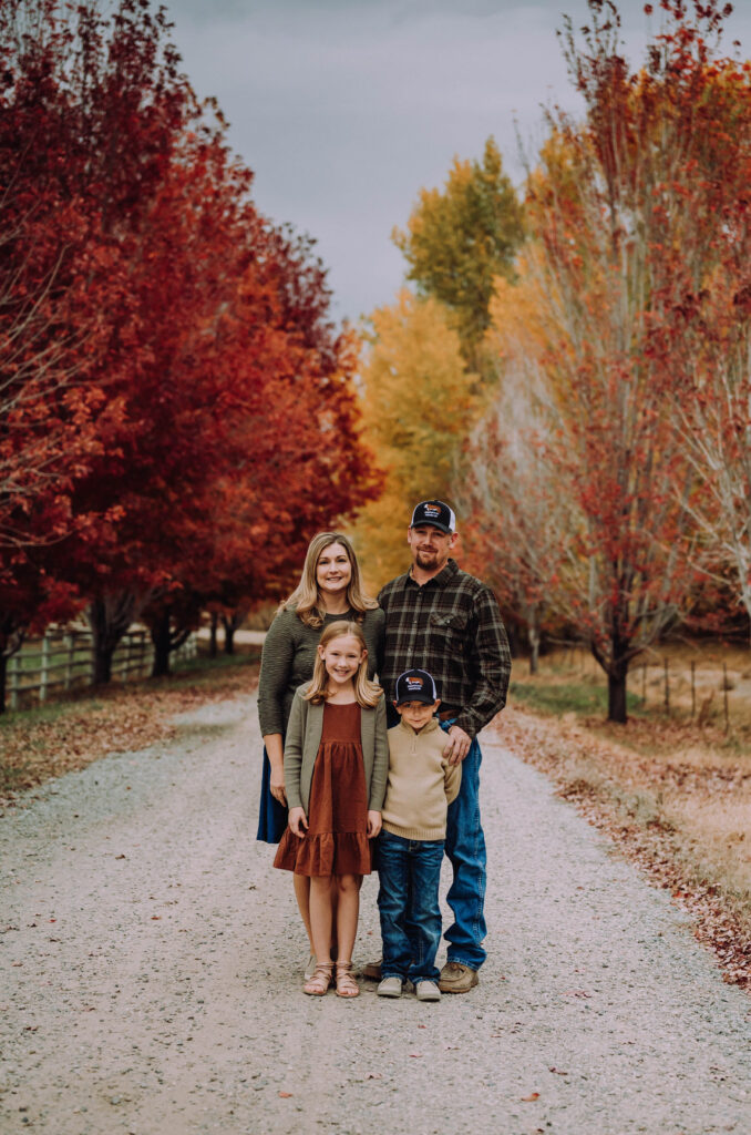 Fall family session with Bellanet Photography in Idaho with vibrant foliage in the background