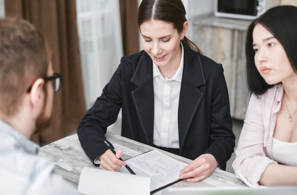 Insurance agent reviewing a document with their clients