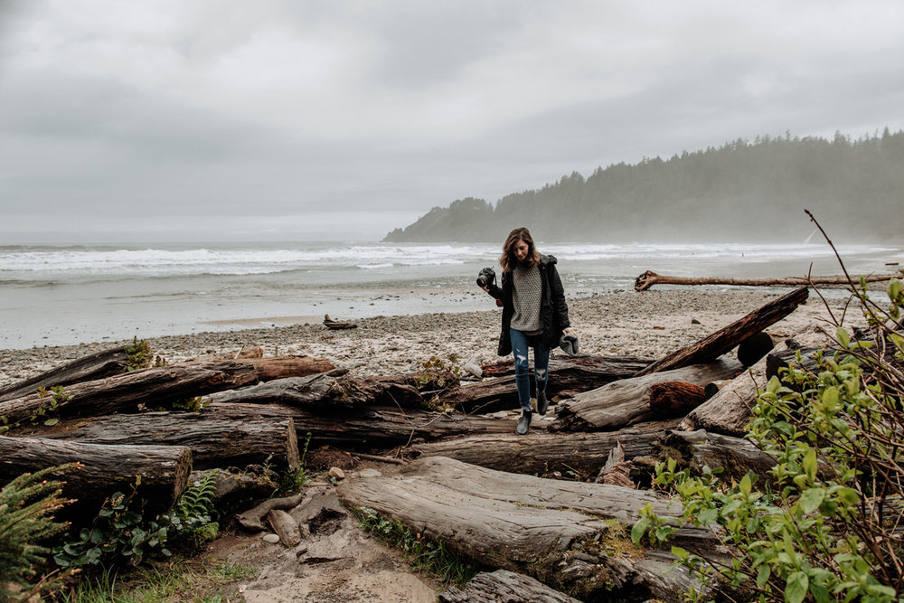 Destination photographer walking on beach in Oregon